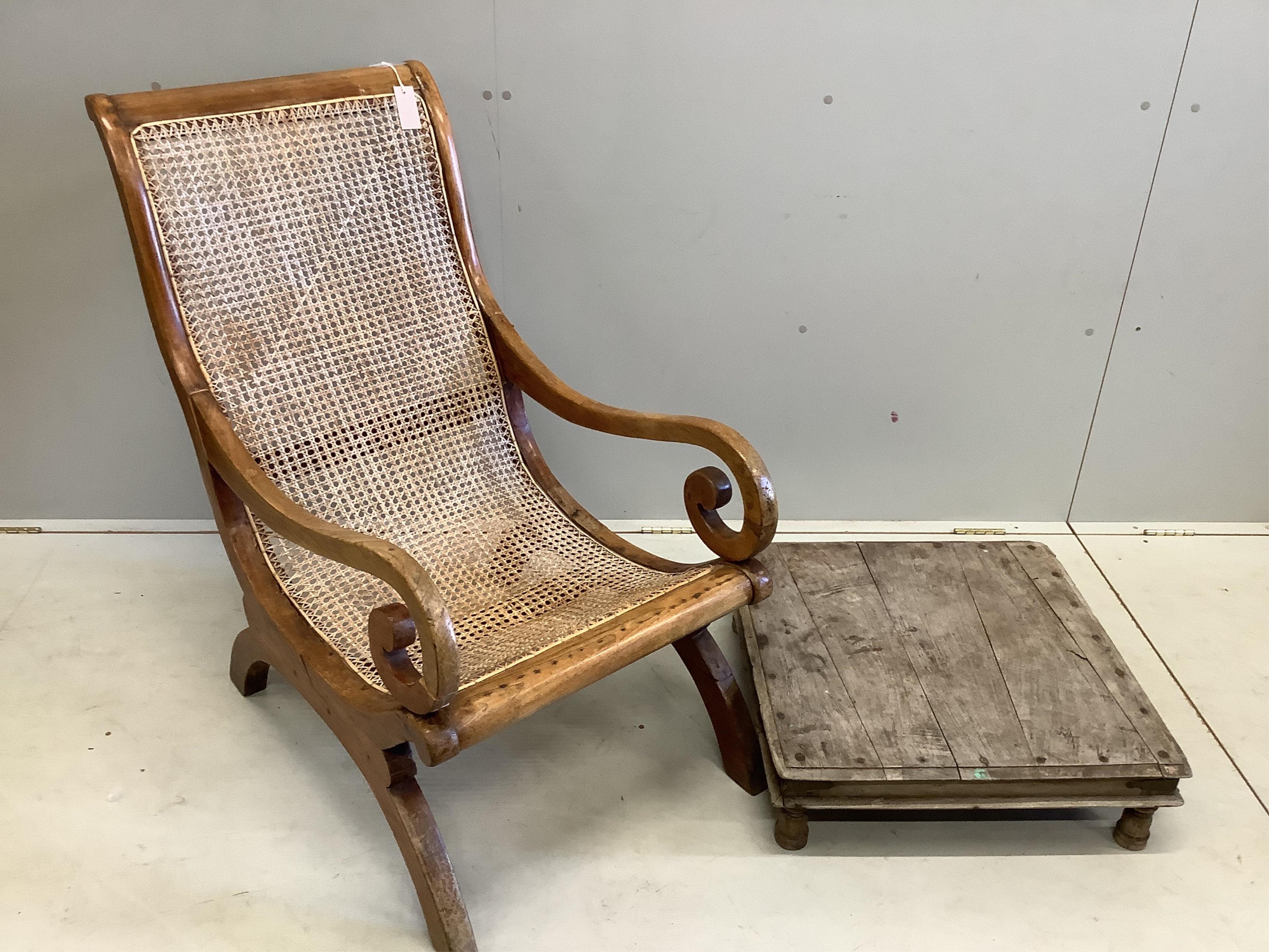 A South East Asian caned hardwood armchair, width 55cm, depth 80cm, height 98cm together with a square low table